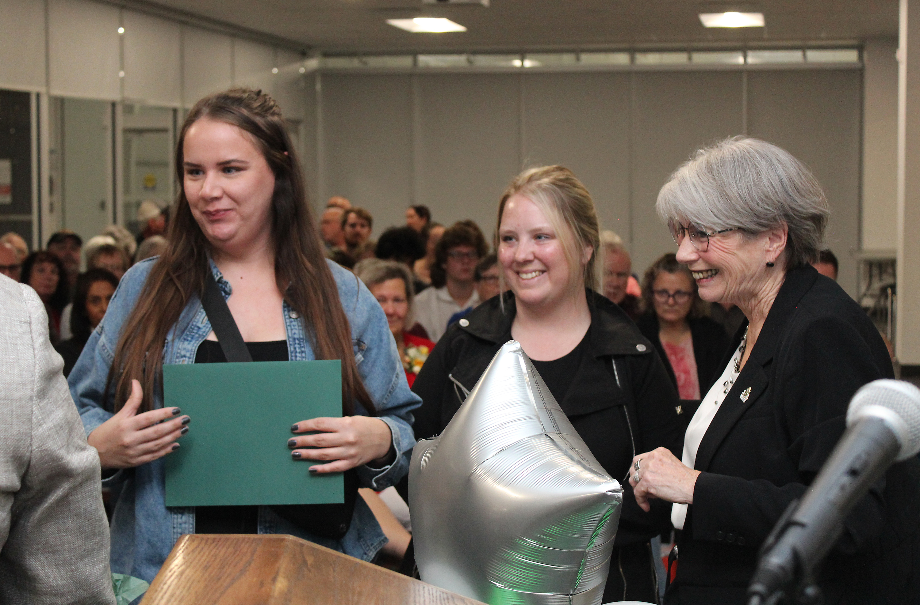 Milt Balint's daughters accept the award on behalf of their father who was unable to attend