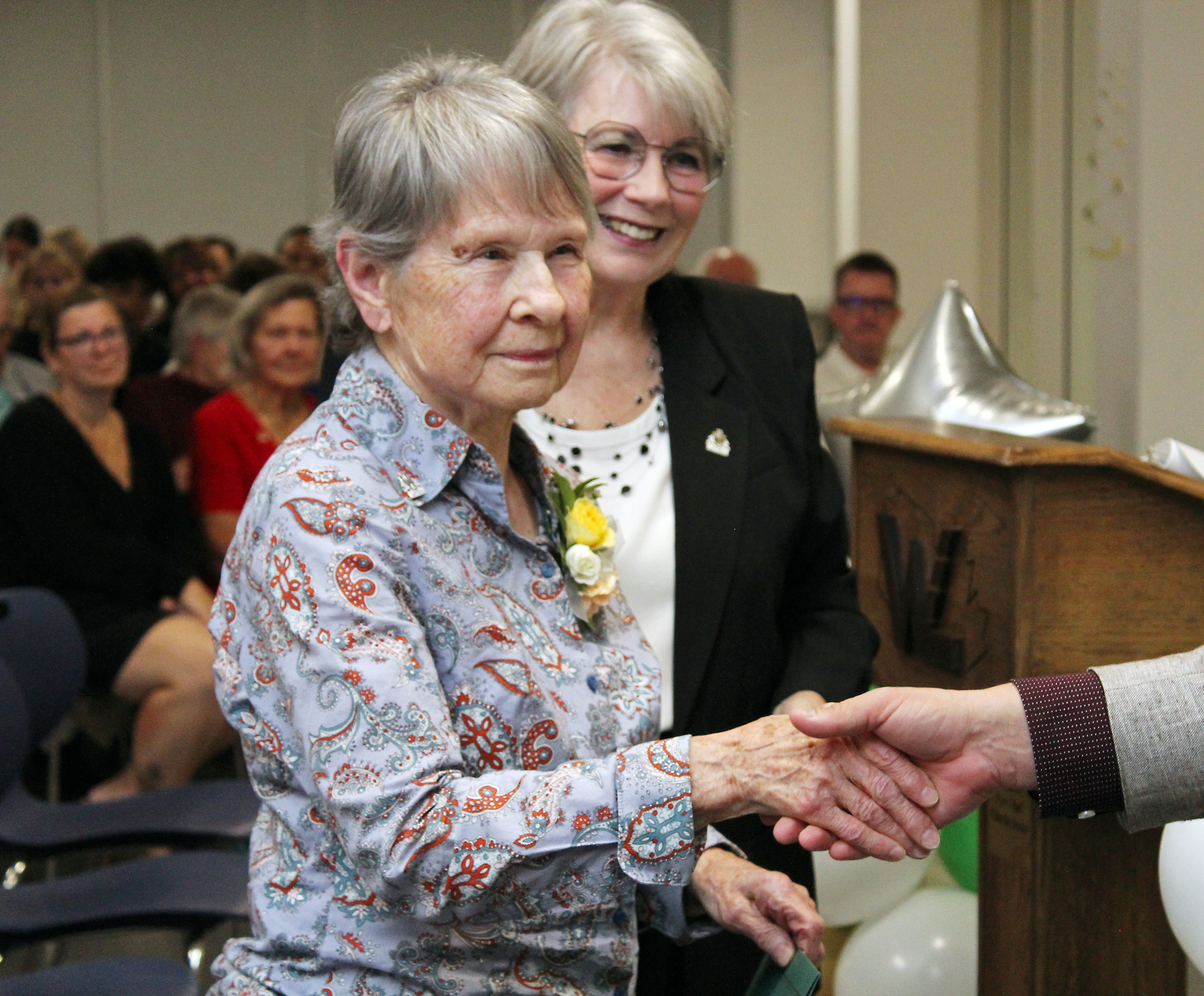 Jean Acton accepts congratulations for her award