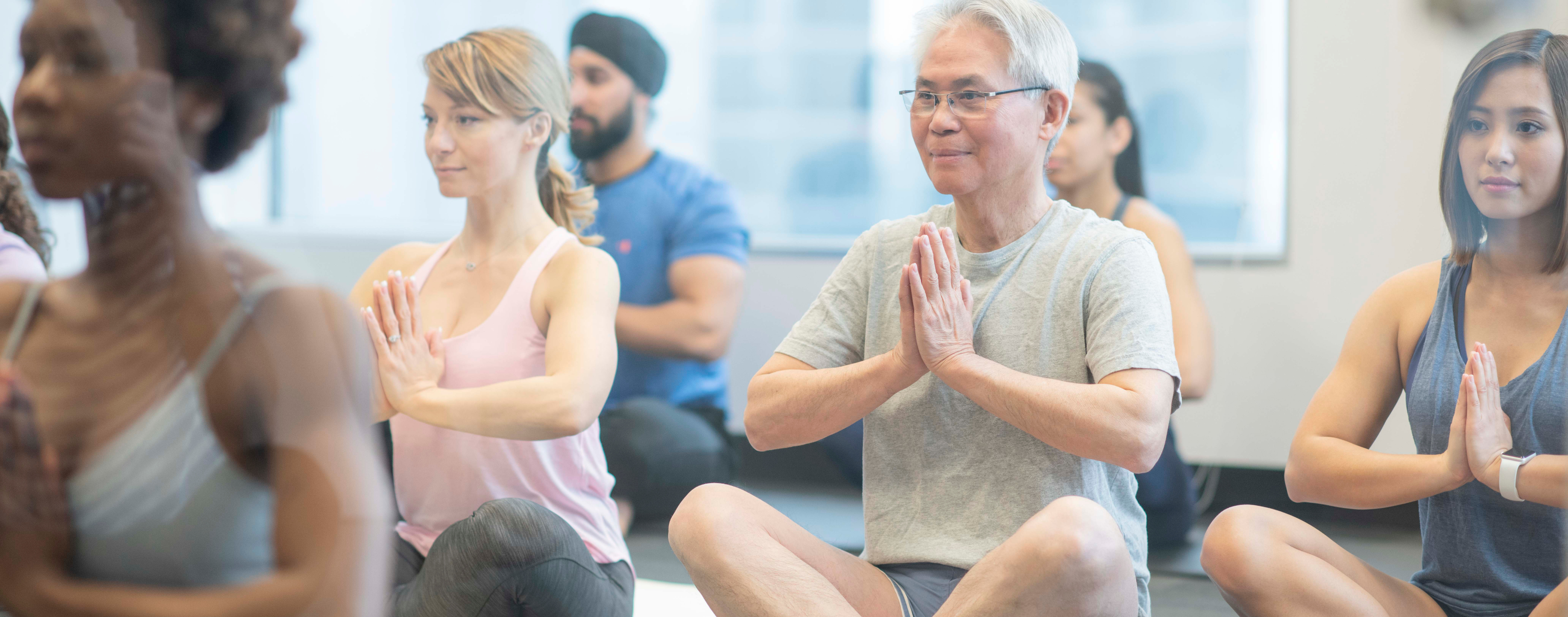 Group of people doing yoga