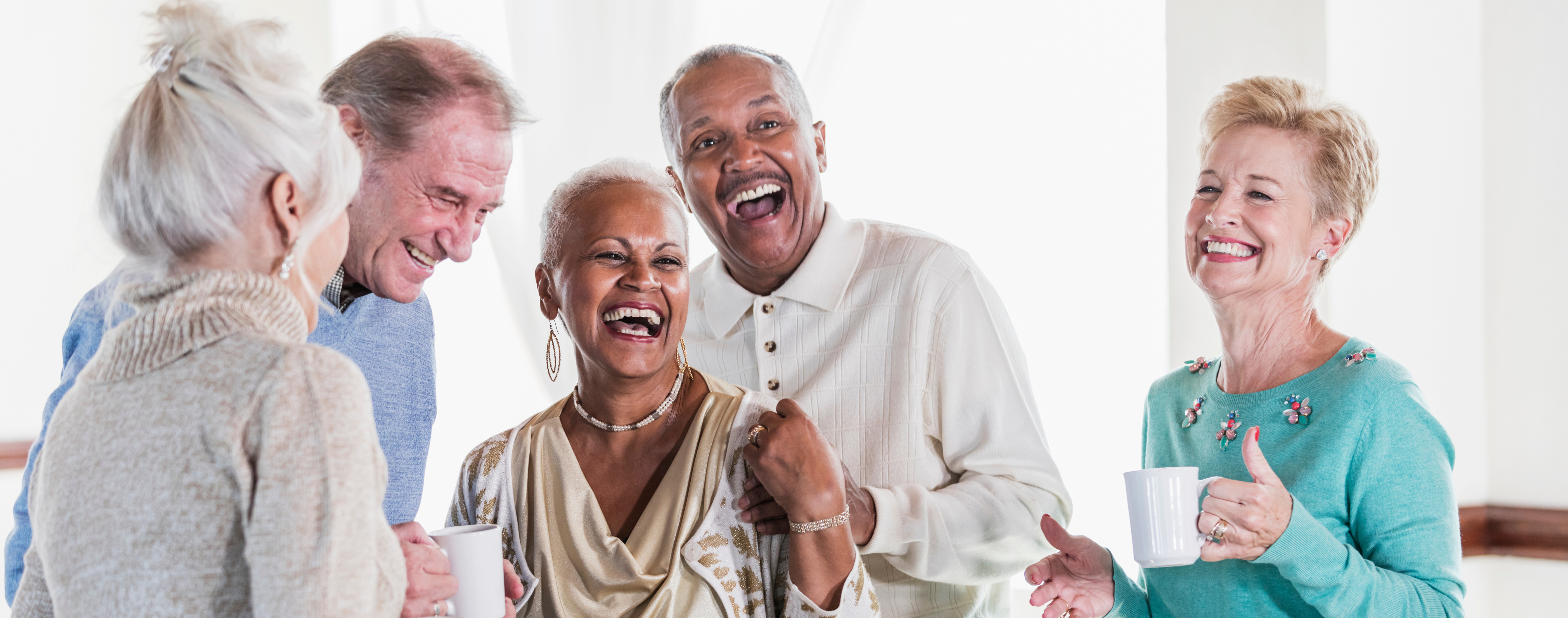 Group of older adults smiling and laughing