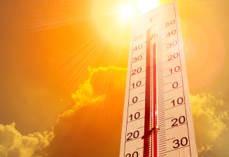 Hot sun and thermometer showing hot temperature