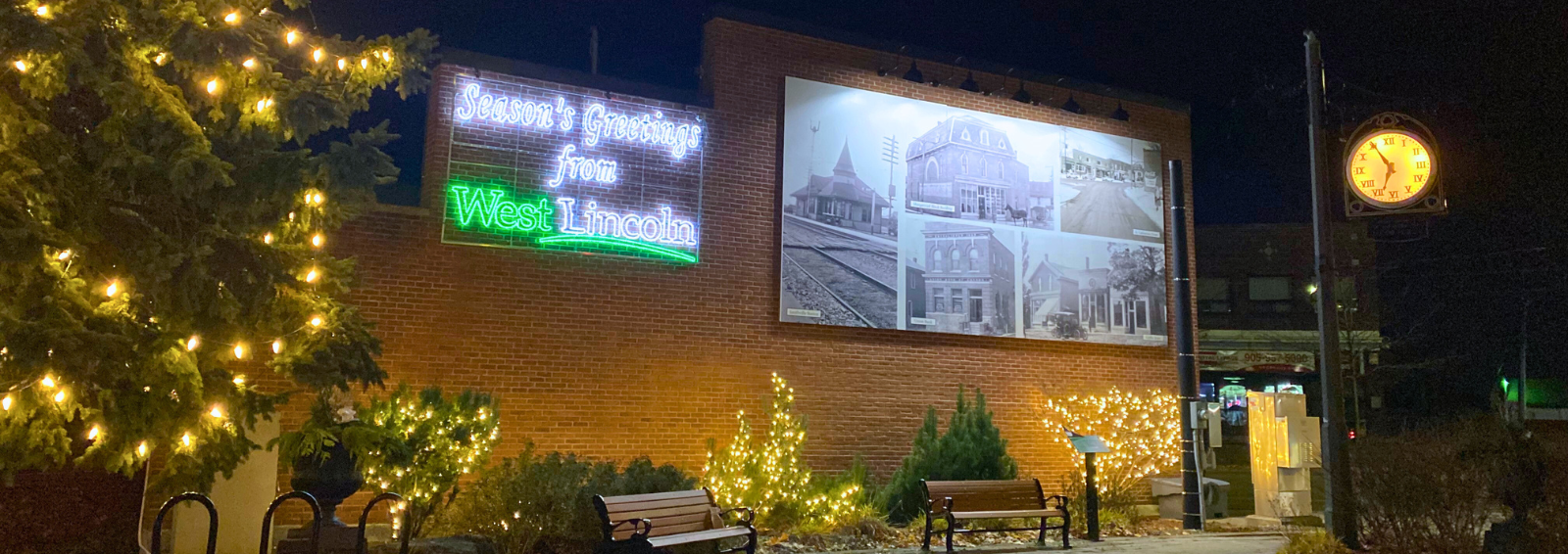 Smithville Parkette lit up for the holidays with sign that says Seasons Greetings from West Lincoln